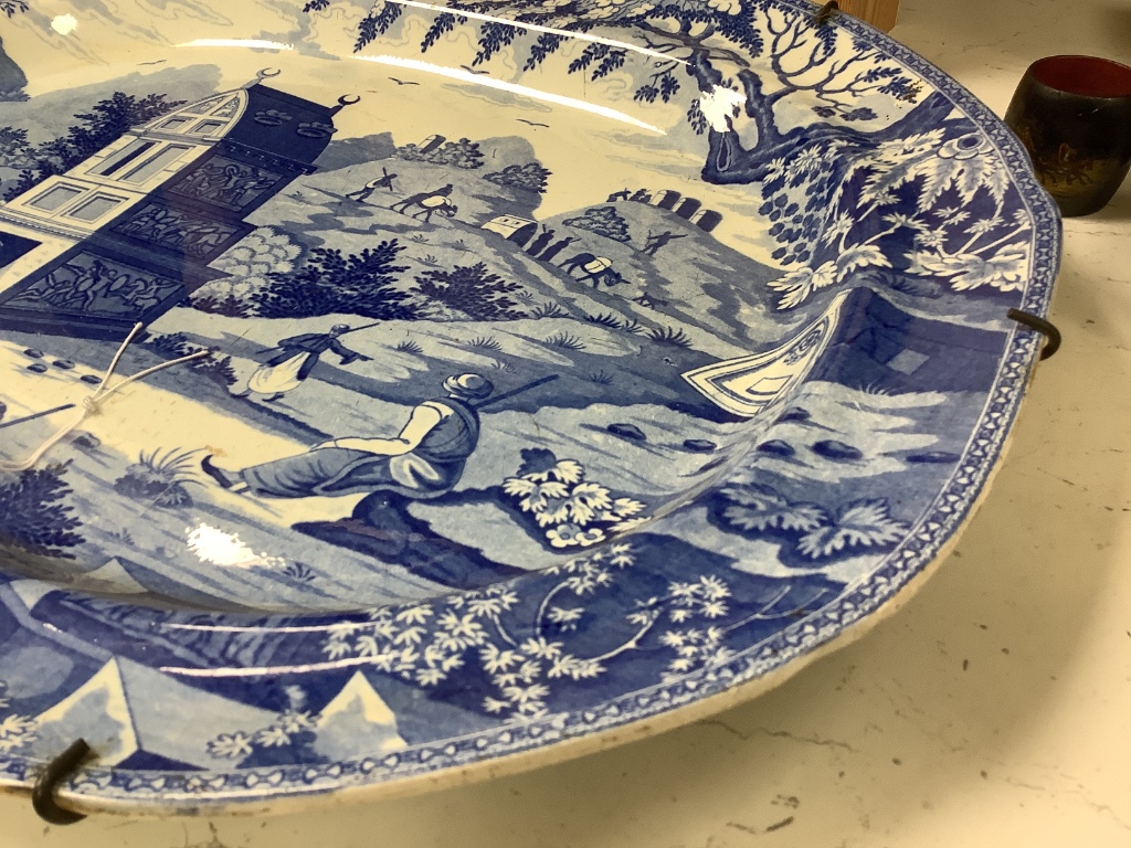 An Orientalist blue and white meat platter, c.1820-40, 52cm